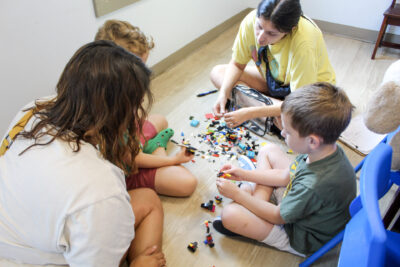 4-IMG_1058 Woman at desk smiling with a child